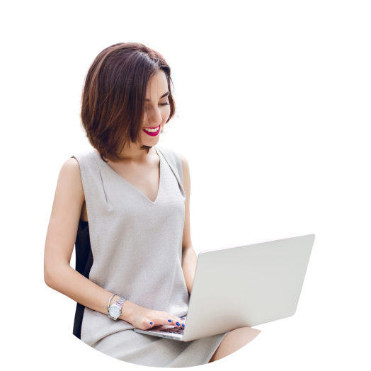 a woman sitting on a chair using a laptop 